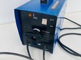 an image of a blue and black welding machine on a white surface