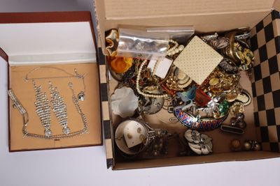 a box with a lot of jewelry inside of it