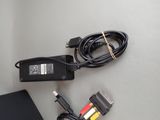 a laptop and a charger sitting on a table