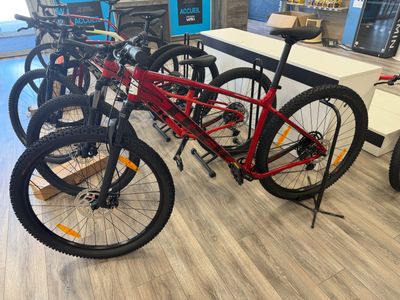 many bikes that are lined up in the store