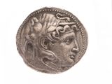 l'image d'une pièce d'argent sur laquelle figure le visage d'une femme