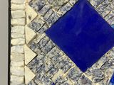 a picture of a blue and white mosaic tile