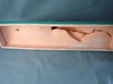a wooden box with a cloth inside of it