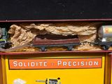 a toy train set in a box on a table