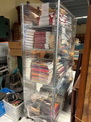 many stacks of papers stacked on top of each other