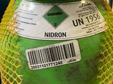 a large green container with a barcode on it