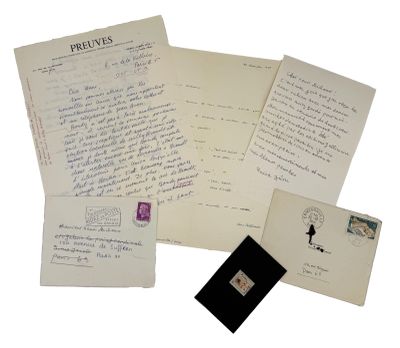 several old letters and envelopes are sitting on a white surface