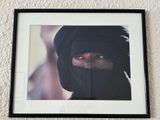 a picture of a woman with a black veil on her head