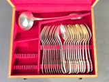 many spoons and spoon spoons in a pink box