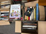 a box full of books on the floor next to a pile of other books