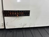 a close up of a white refrigerator with a sticker on it
