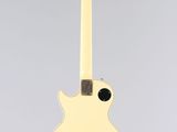 an electric guitar with a white body and black strings