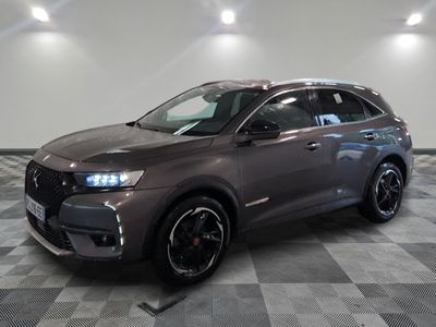 a grey suv parked in a room with a checkered floor