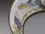 a close up of a decorative object with a man and a woman on it