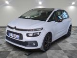 the white citrole is parked on a checkered floor