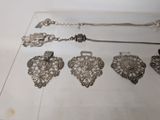 a lot of silver items that are on a table
