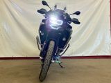 a motorcycle that is parked in front of a wall