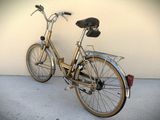 a bike that is parked against a wall