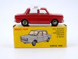 a red toy car sitting on top of a box