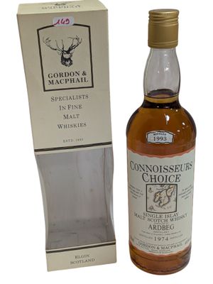 an image of a bottle of whisky sitting next to a box