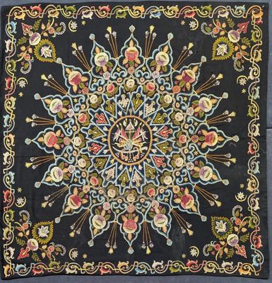a black square with a floral design on it