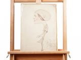 un dessin représentant une femme coiffée d'un chapeau, posé sur un chevalet