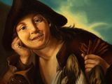 portrait of a boy holding a dead bird and a bird in his hand