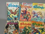 several comics are stacked on top of each other on a table