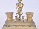 brass figurine of a boy with a bucket and two vases