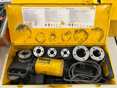 a yellow tool box with a bunch of tools inside of it