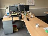 a desk with two monitors and a laptop on it