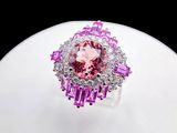 an image of a pink and white diamond ring on top of a white surface