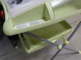 a baby changing table that has a baby in it