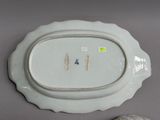 a white plate with a blue and white design on it