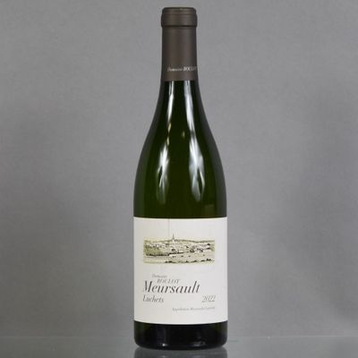 a bottle of wine sitting on a table