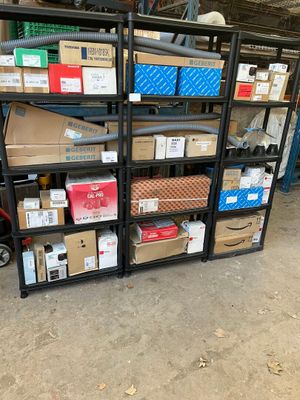many boxes and boxes on the shelves in the garage