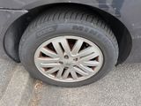 a car that has a flat tire on the street