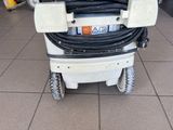 a machine that is sitting on a tile floor