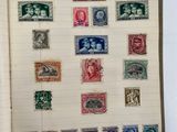 an open book with a bunch of different stamps on it
