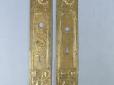 pair of antique brass door handles with flowers and birds