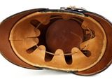 a baseball glove that is inside of a catcher ' s mitt