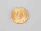 an image of a gold coin sitting on top of a white surface