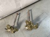 pair of antique brass door handles with lion heads on them