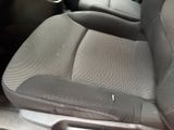 the interior of a car with the front seats folded down