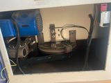 a machine that is sitting inside of a cabinet