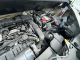 a picture of a car engine with its hood open