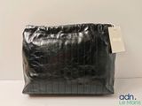 the large black bag has a tag on it