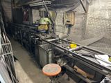 a picture of a machine that is working on a piece of metal