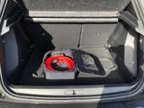 a trunk of a car with a speaker in it