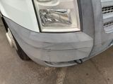 a close up of a truck ' s headlight and front bumper